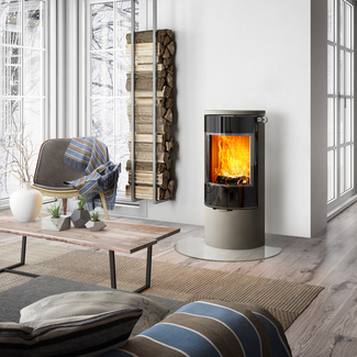 Wood stove VIVA 100 L in nickel with glass door in an elegant country-style living room