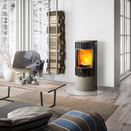 Wood stove VIVA 100 L in nickel with glass door in an elegant country-style living room