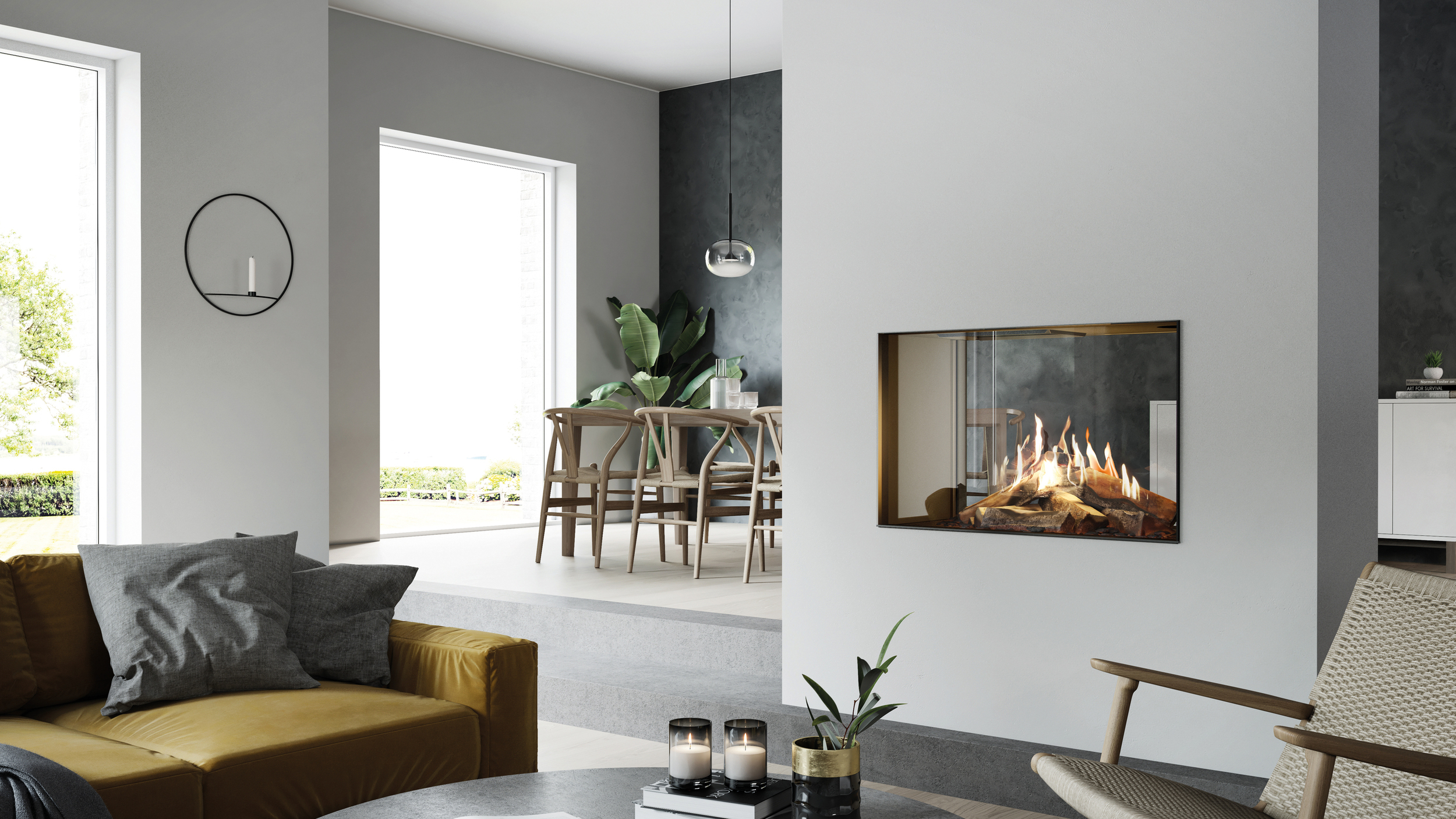 VISIO 90 T gas fireplace is located in the centre of the brightly furnished room, yet still provides a tunnel-like view from the living room to the dining room and kitchen