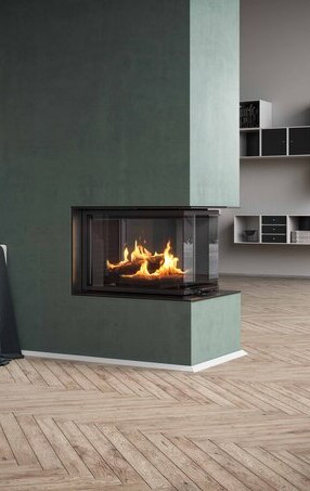 Wood fireplace VISIO 3:1 are integrated into a green wall as a room divider that structures the living space