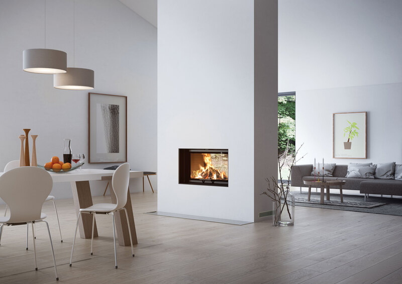 Wood fireplace VISIO TUNNEL stands in the centre of the brightly furnished room yet still allows a view from the living room to the dining room