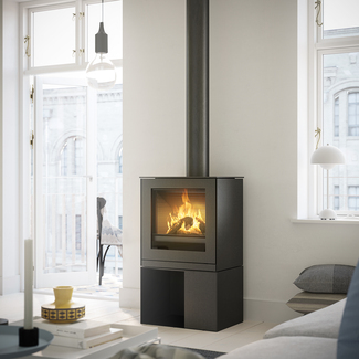 Gas stove Q-TEE 2 with steel door and practical base unit in urban flat