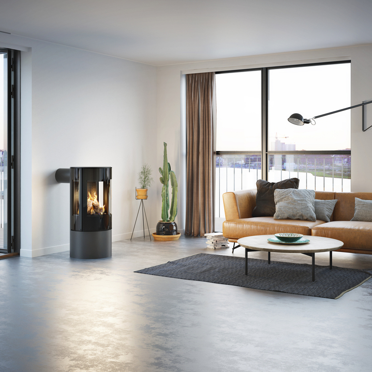 Gas stove VIVA 100 L in platinum with glass door in a minimalist flat with a view of the skyline