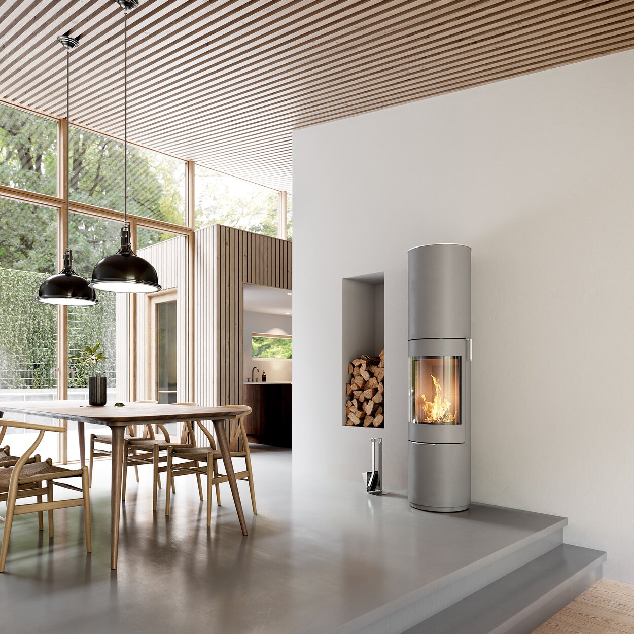 Wood stove PILAR in nickel with steel door and stainless steel handle in the dining room with modern furnishing style