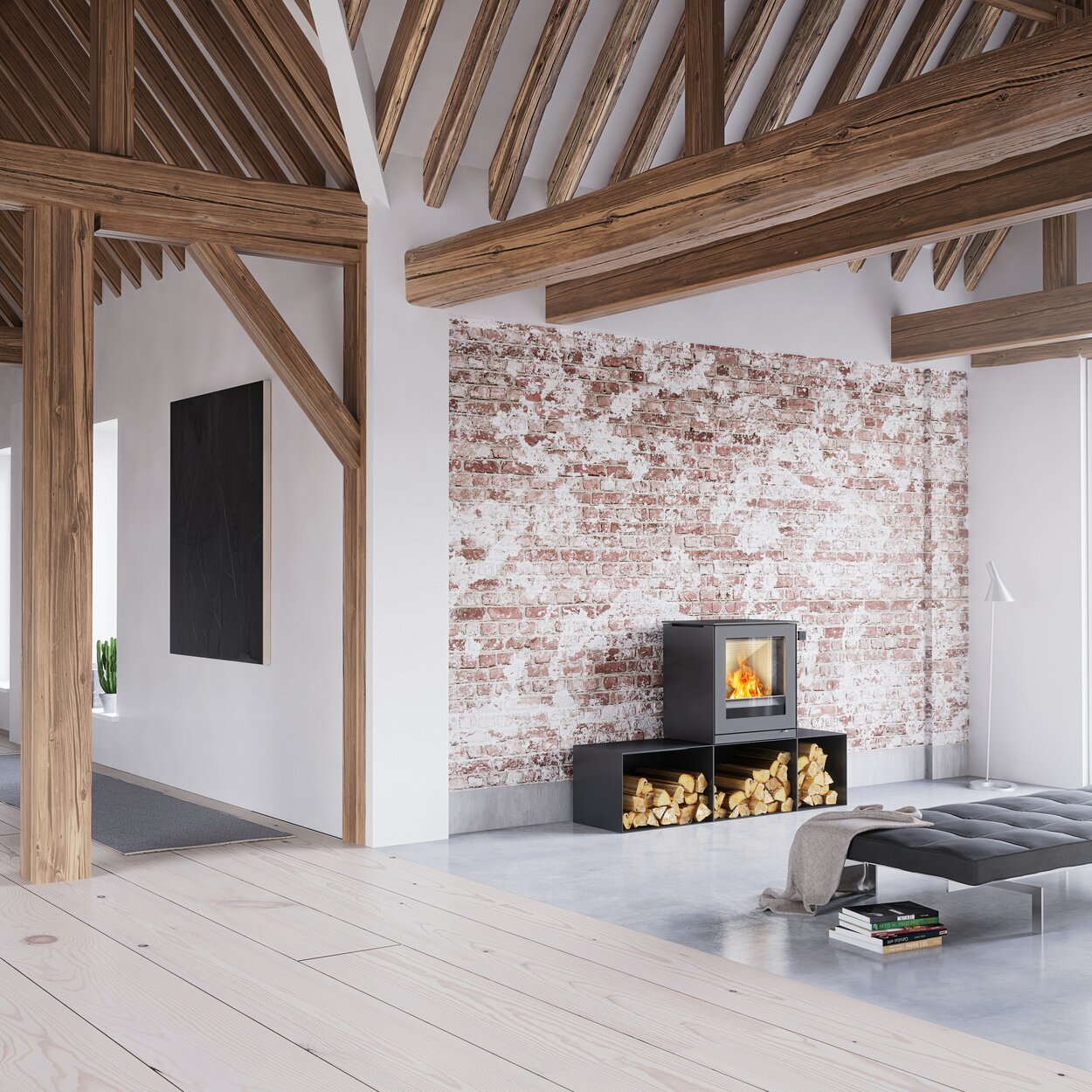 Holz-Kaminofen Q-TEE 2 in Schwarz mit Seitenbänken in einem minimalistisch eingerichteten, rustikalen Haus 