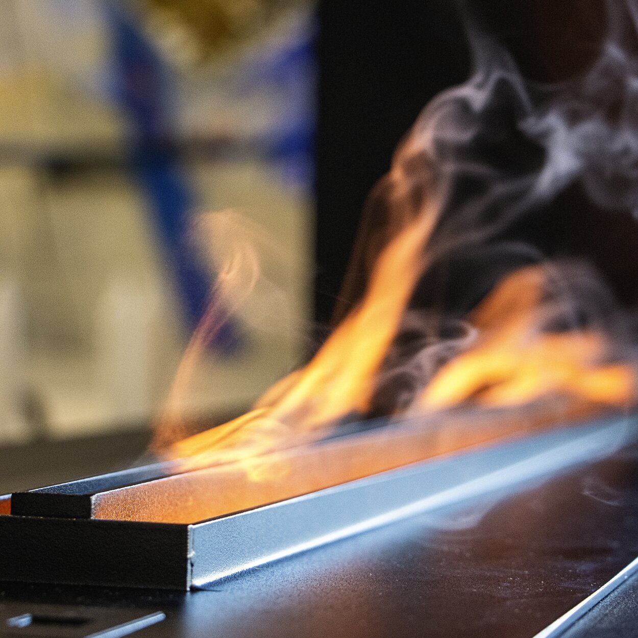 Water vapour and steel detail of the Hybrid Mist electric fireplace