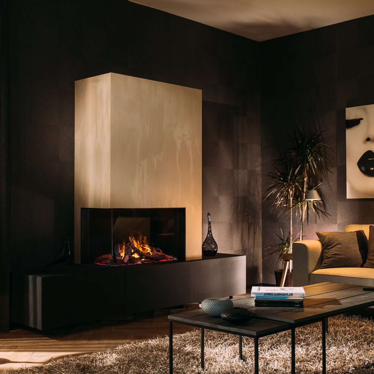 Electric fireplace e-Matrix Mood 800/500 corner version in a dark living room with light-coloured stone cladding