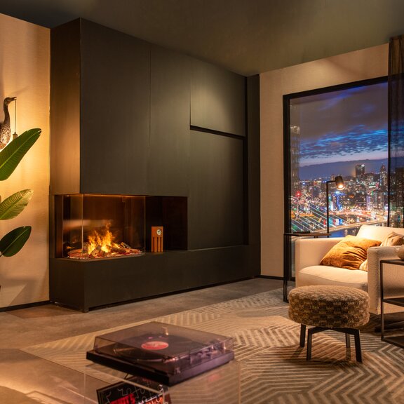 Electric fireplace e-Matrix Mood 800/650 glazed on 3 sides in a modern city flat built into a dark wall