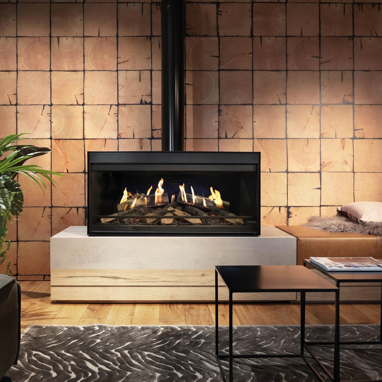 The free-standing E-One 100 Front in the living room with industrial style in front of a creek stone wall.