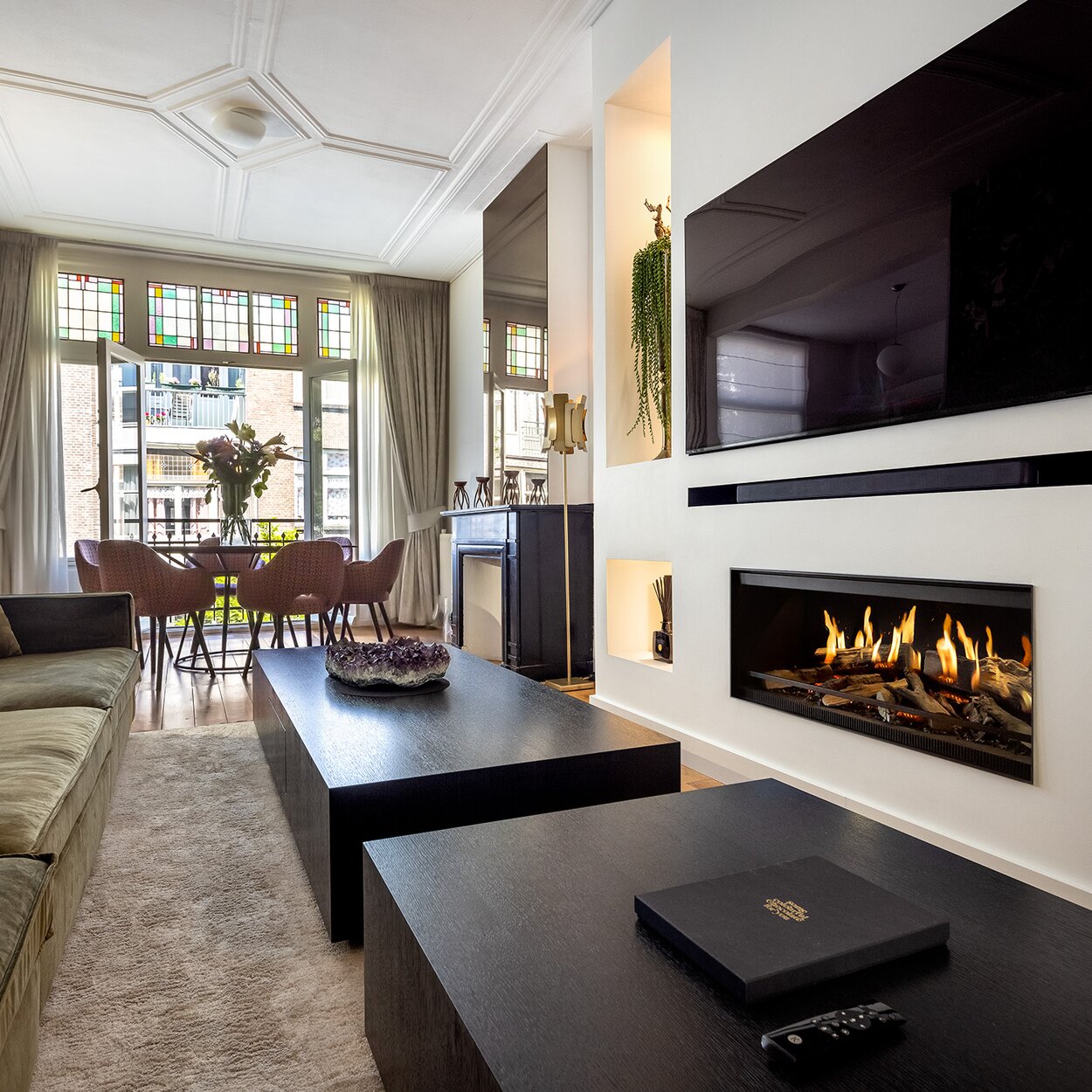 The E-One 100 Front electric fireplace in a modern French-style living room.