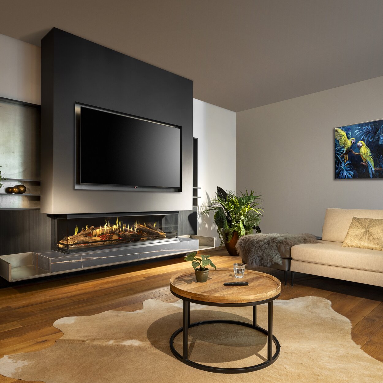 3-sided electric fire E-One 160 S built into a black sideboard including TV.