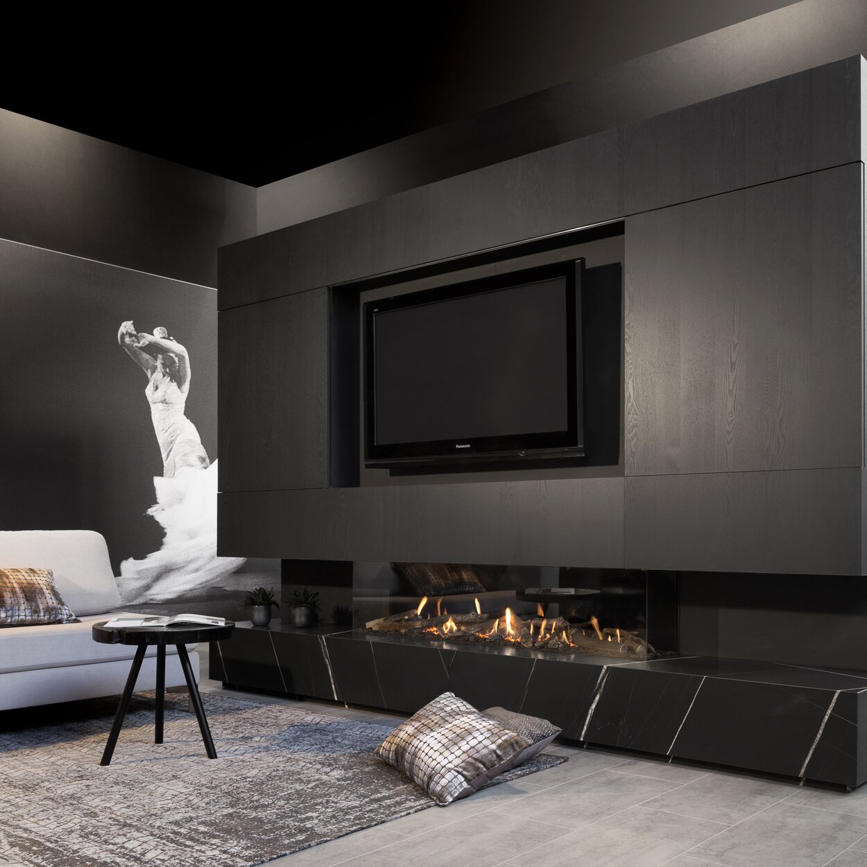 Gas fireplace G170/37S glazed on 3-sided built into black wall unit with integrated TV in modern living room