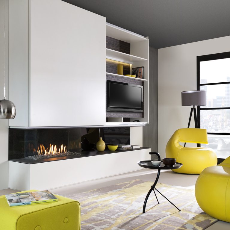 Gas fireplace G90/44S 3-sided glazed with white panelling in a bright living room with yellow accents