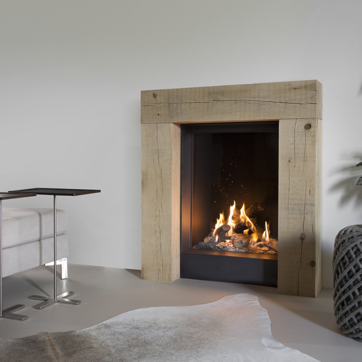 Front version gas fireplace GP60/79F in white wall with wooden frame installed in the living room