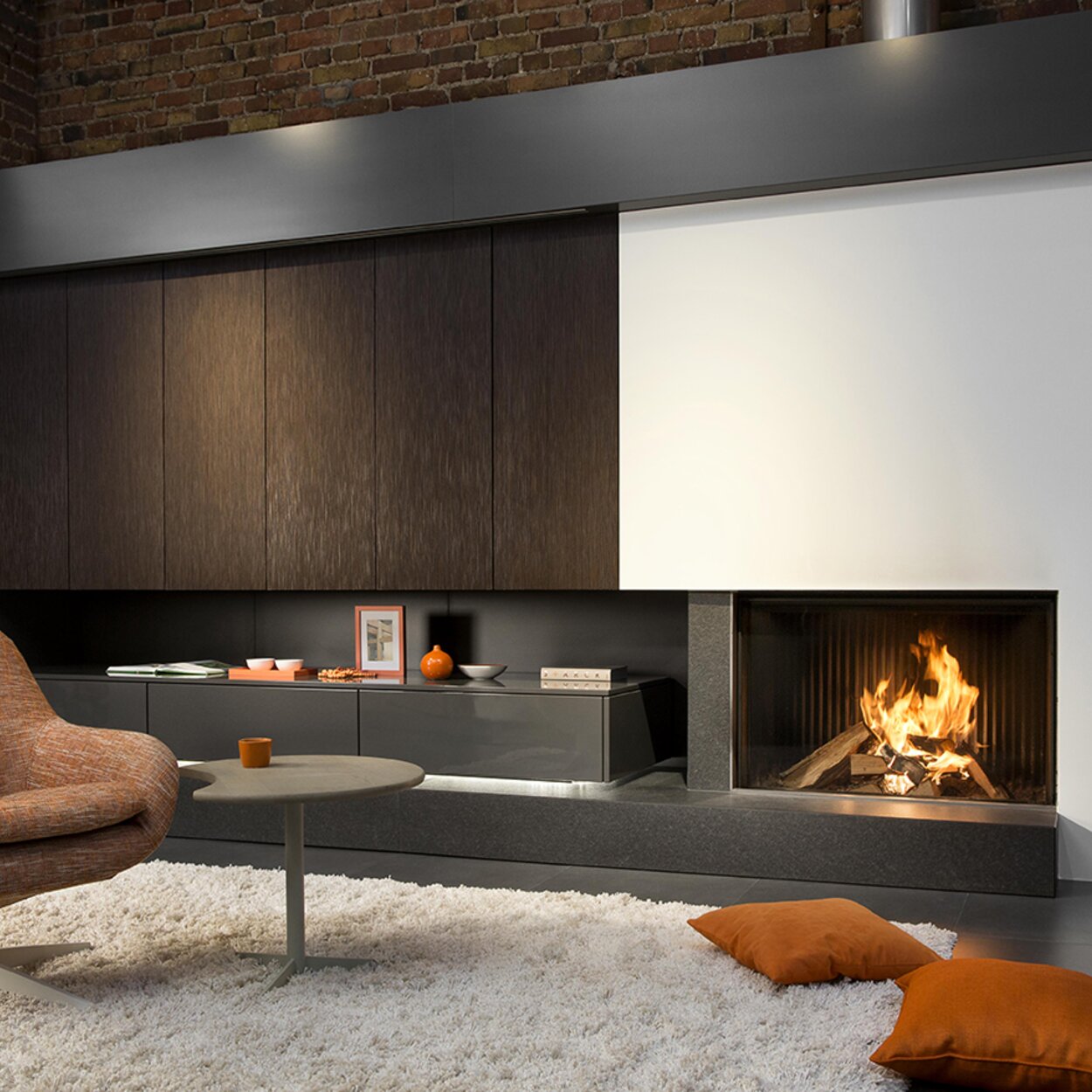 Wood fireplace W100/61F by Kalfire in front version in stylish living room with dark brown brick walls