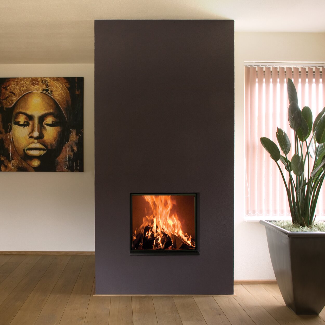 Wood fireplace W60/51F by Kalfire symmetrically installed in a grey-painted wall in a minimalist living room